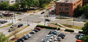street intersection with bus and pedestrians