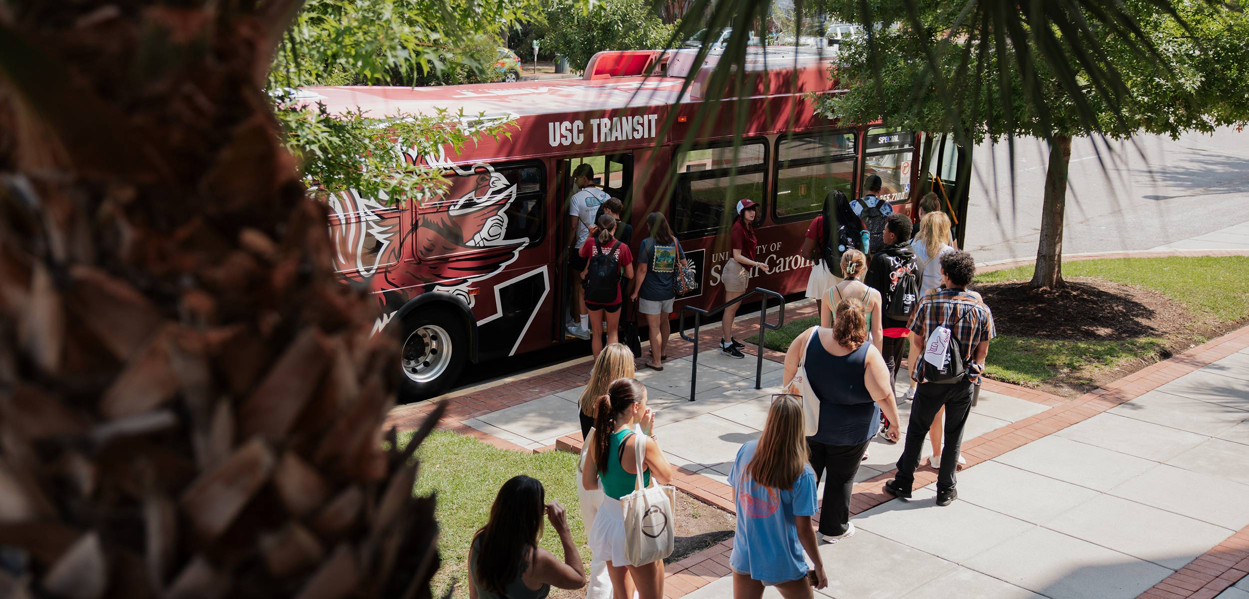 USC students board the campus shuttle.
