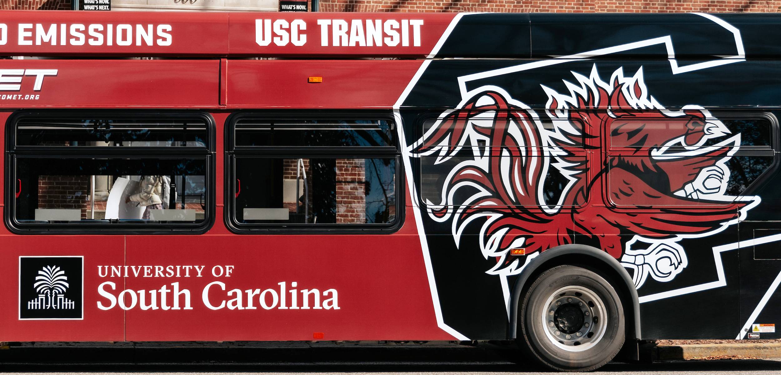 USC shuttle with Gamecock Block C logo on the side.