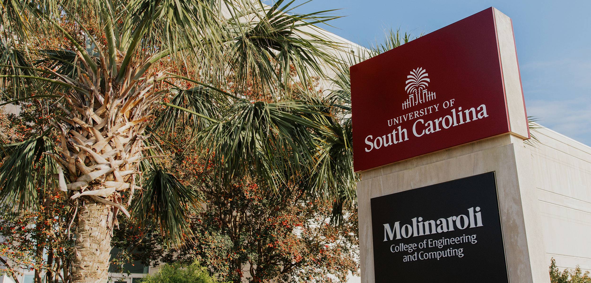 Sign for the Molinaroli College of Engineering and Computing. University of South Carolina logo on garnet at top and Molinaroli College of Engineering on black.