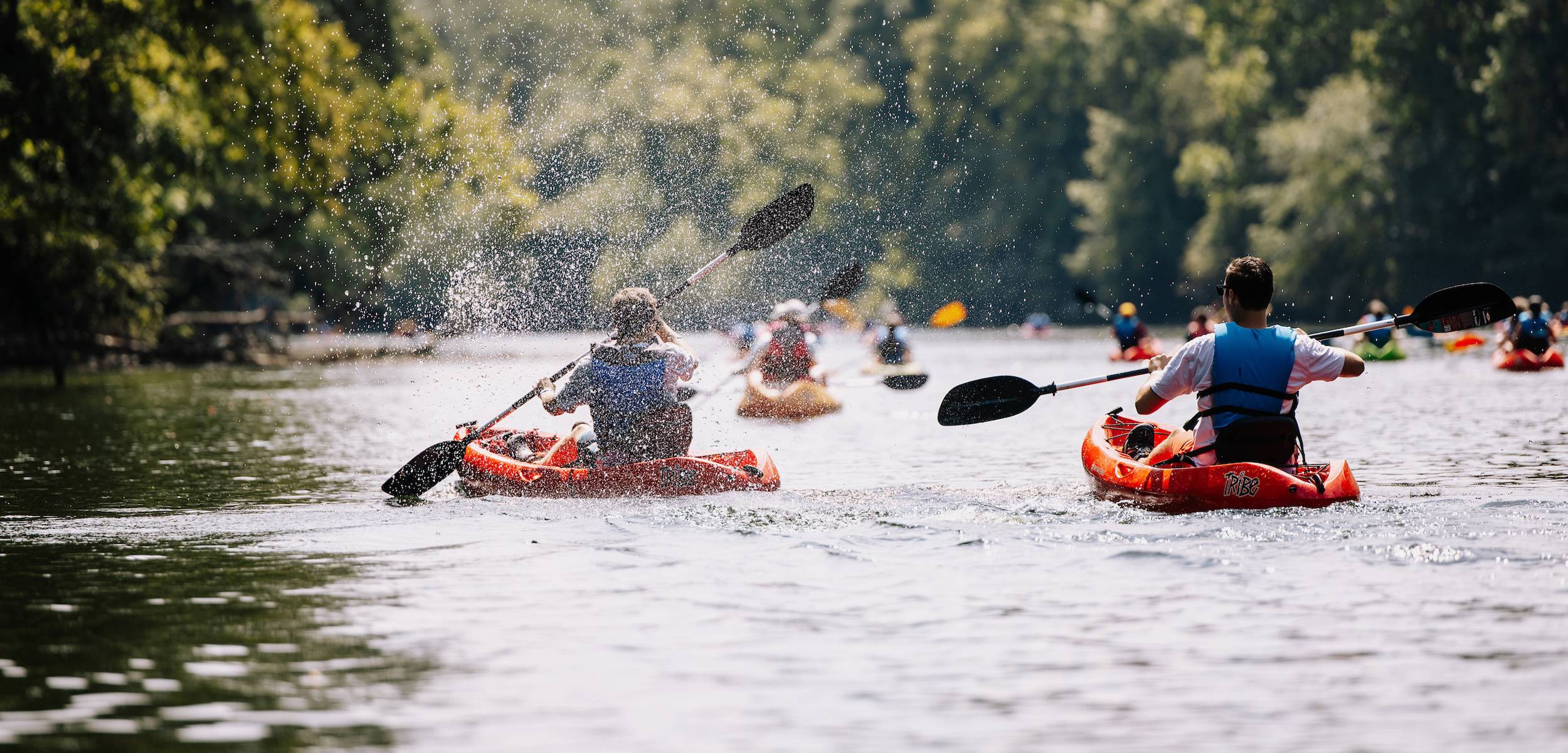 students kayaking down the saluda river