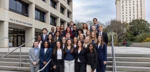A group of Dawn Staley Leadership Academy members pose outside the Close-Hipp building.