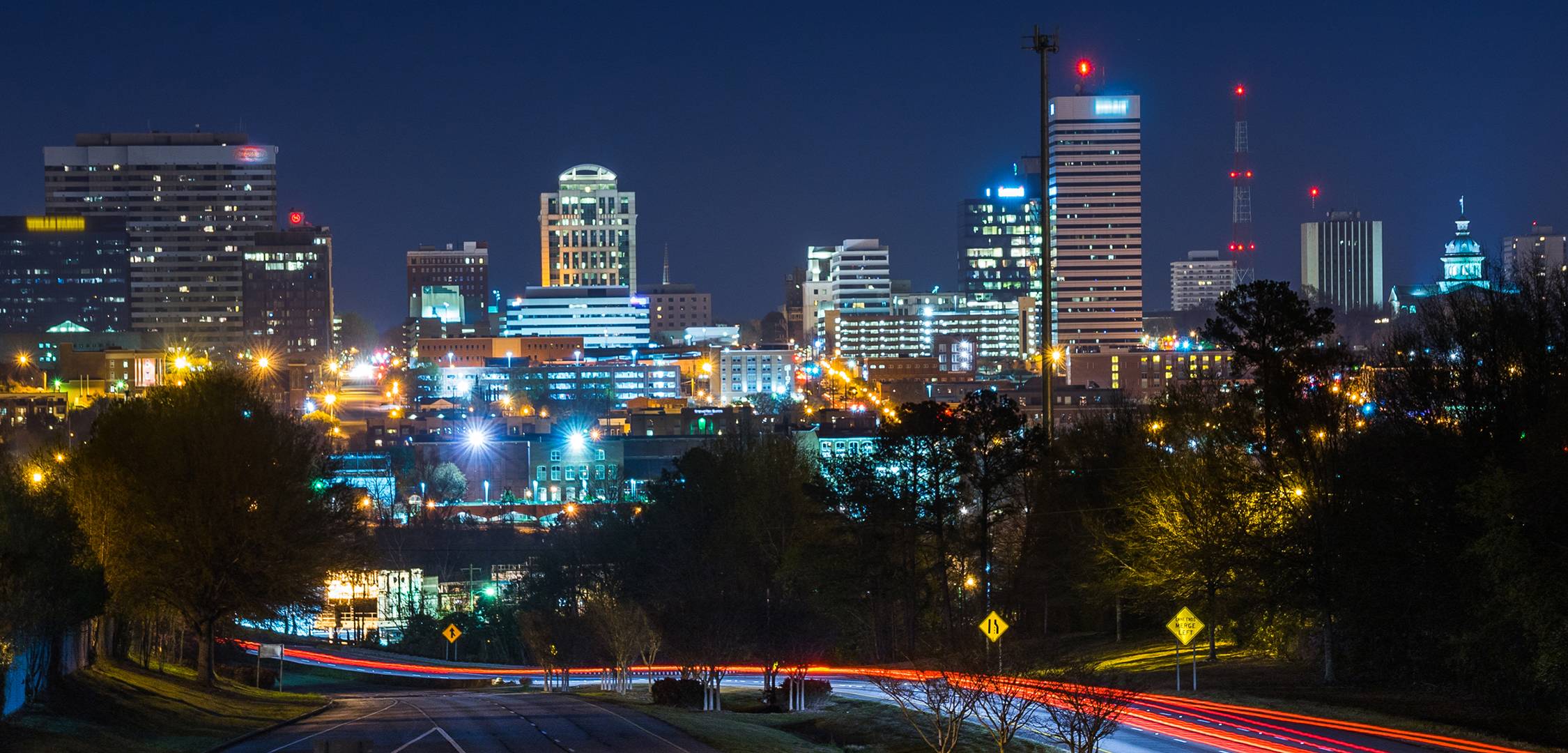 night time view of downtown Columbia; buildings lit up