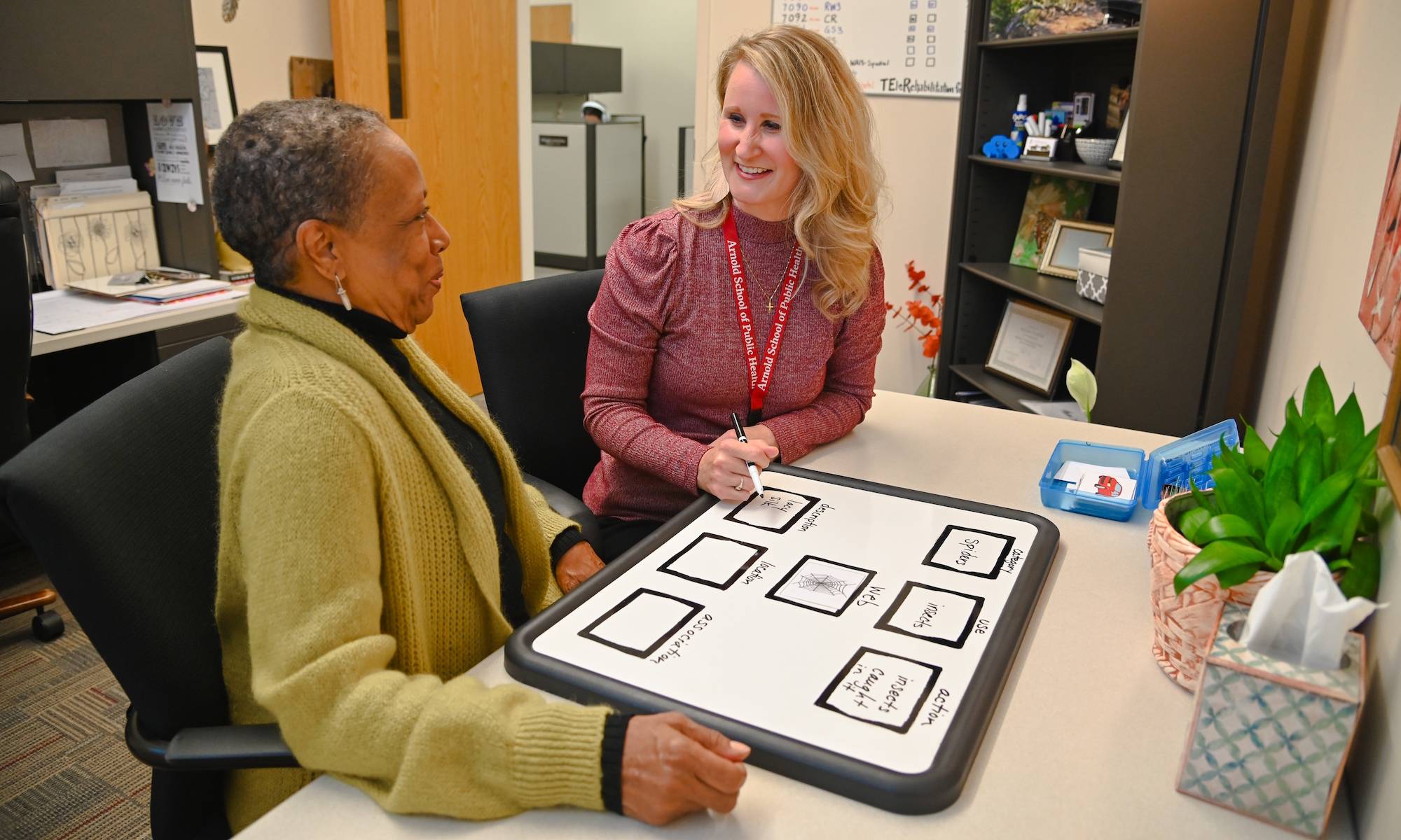 Speech pathologist speaking with a patient