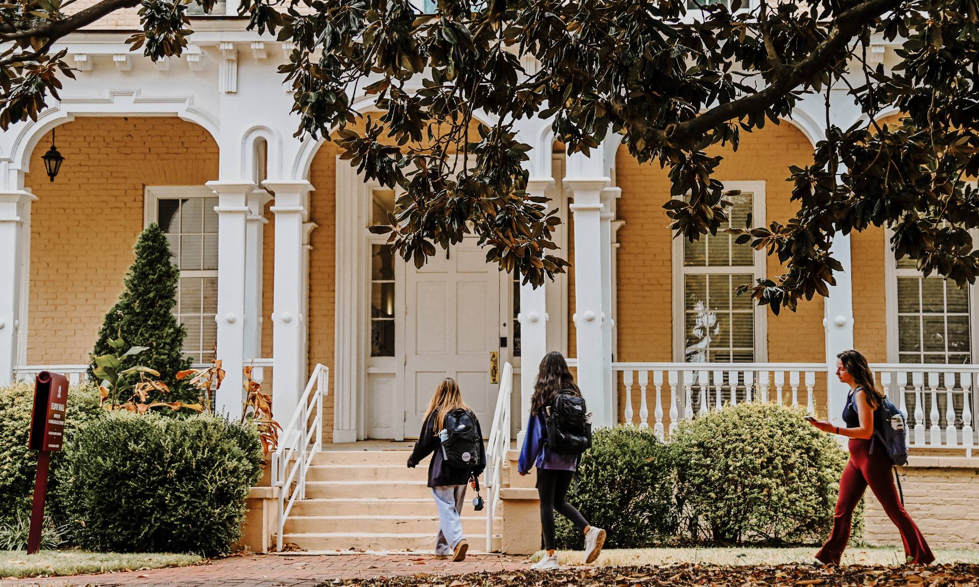 students walking in front of university building